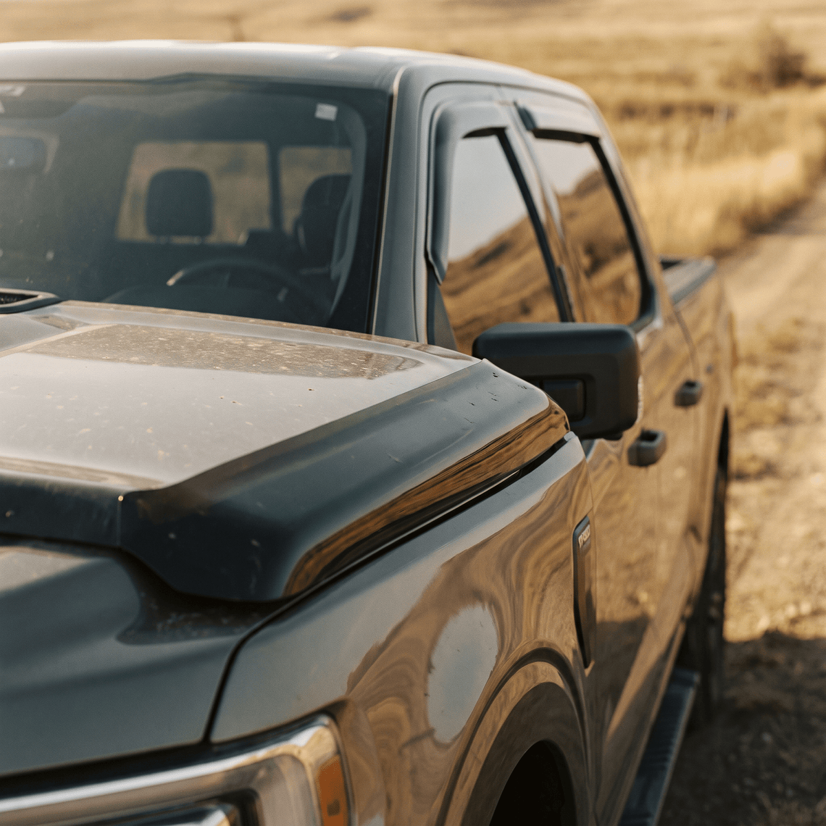 Matte black truck bed deflector installed on pickup side panel
