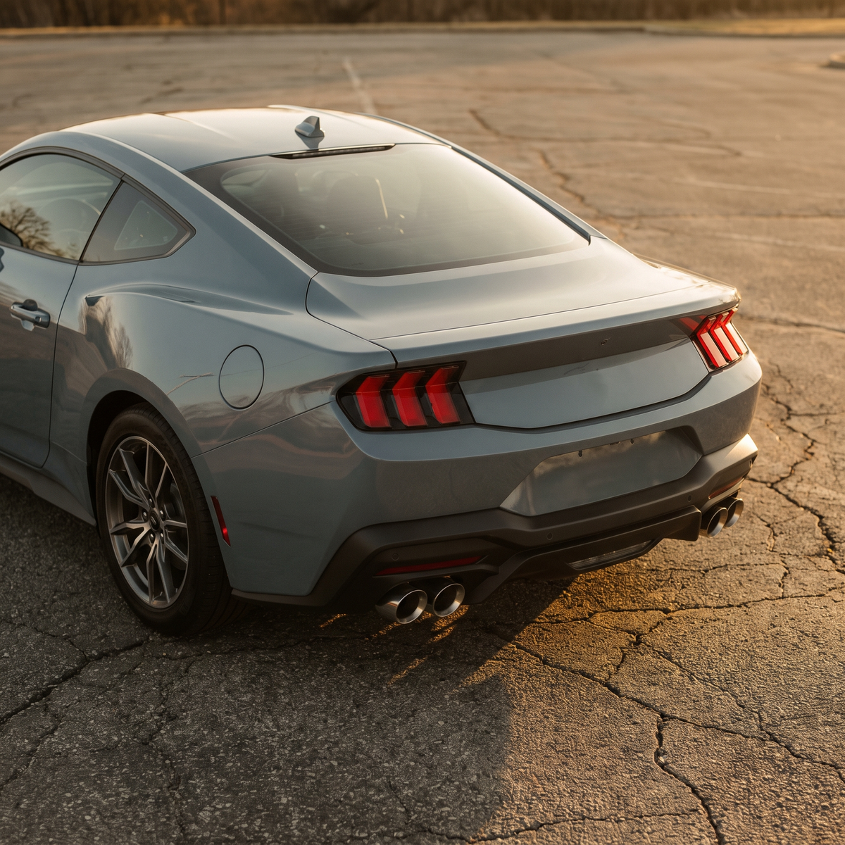 Grey 2024+ S650 Ford Mustang GT with a cat-back exhaust at golden hour