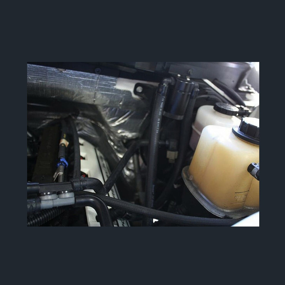 J&L J&L 11-17 Ford F-150 5.0L / 11-14 Ford F-150 6.2L Driver Side Oil Separator 3.0- Black Anodized, installed