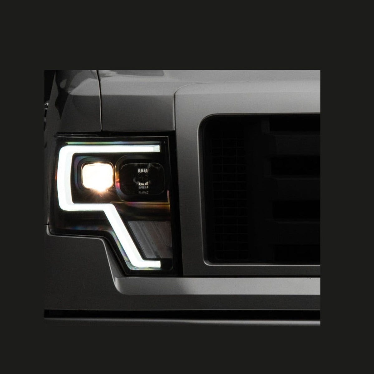 Raxiom Raxiom 09-14 Ford F-150 G4 Projector Headlights- Black Housing (Clear Lens)